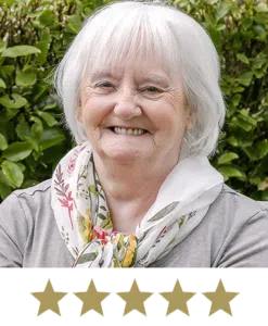Hair Volume™ 12 Woman smiling with five stars displayed underneath.