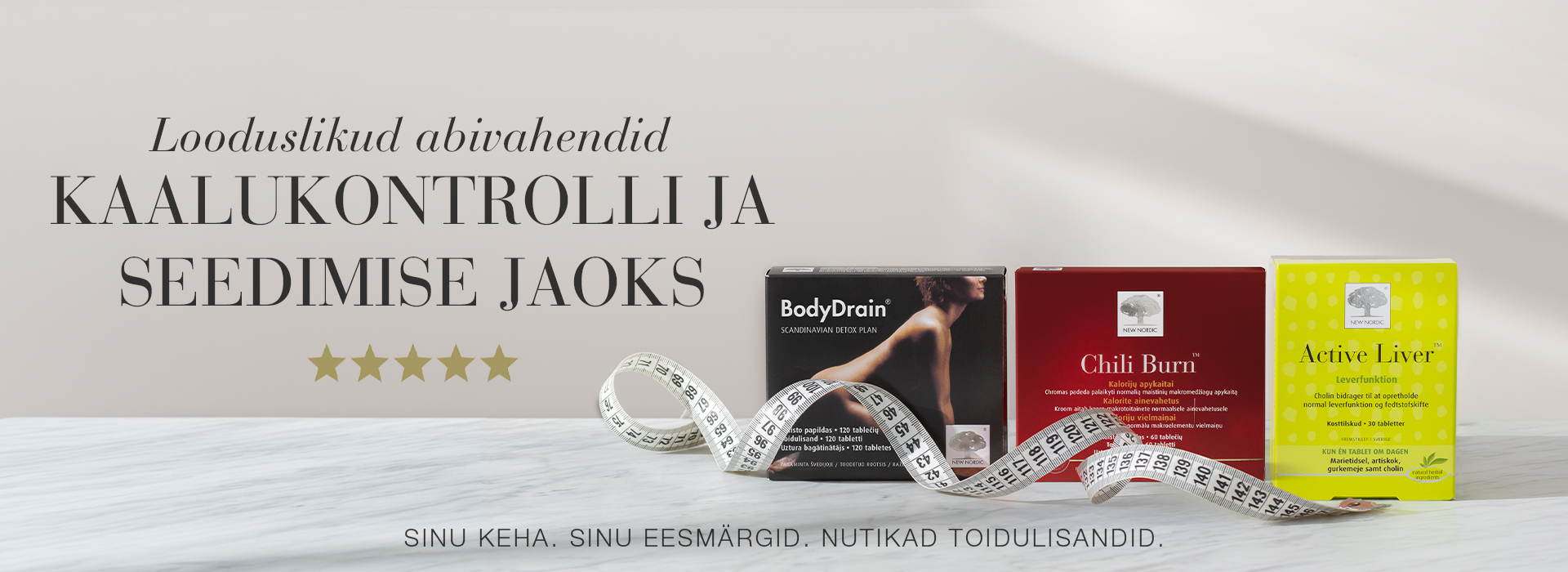New Nordic BodyDrain®, Chili Burn™ ja Active Liver™ pakendid mõõdulindiga heledal taustal.